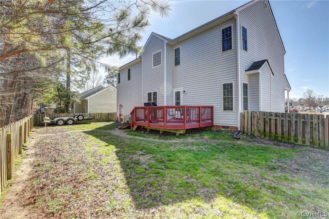 15855 Sandwave Road Chester, VA 23831 - Photo 38 of 42 a view of backyard of house with wooden fence and large trees