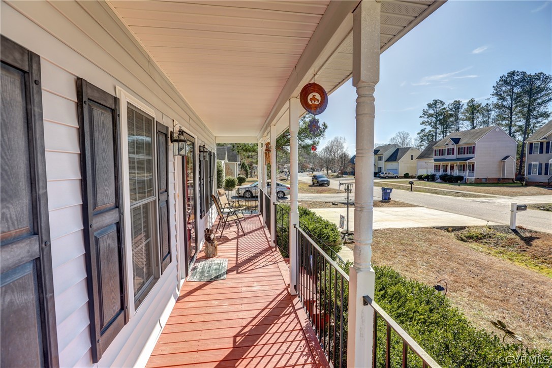 15855 Sandwave Road Chester, VA 23831 - Photo 40 of 42 a view of a porch with wooden floor