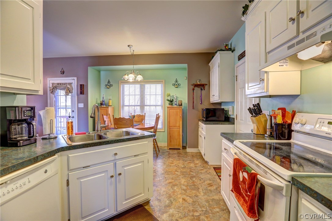 15855 Sandwave Road Chester, VA 23831 - Photo 10 of 42 a kitchen with stainless steel appliances granite countertop a sink and cabinets