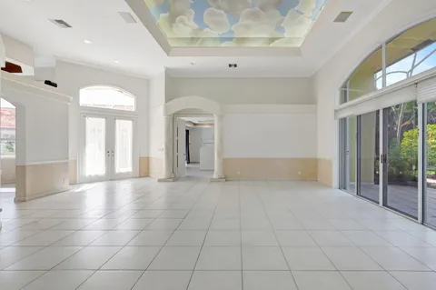 a view of an empty room with glass door