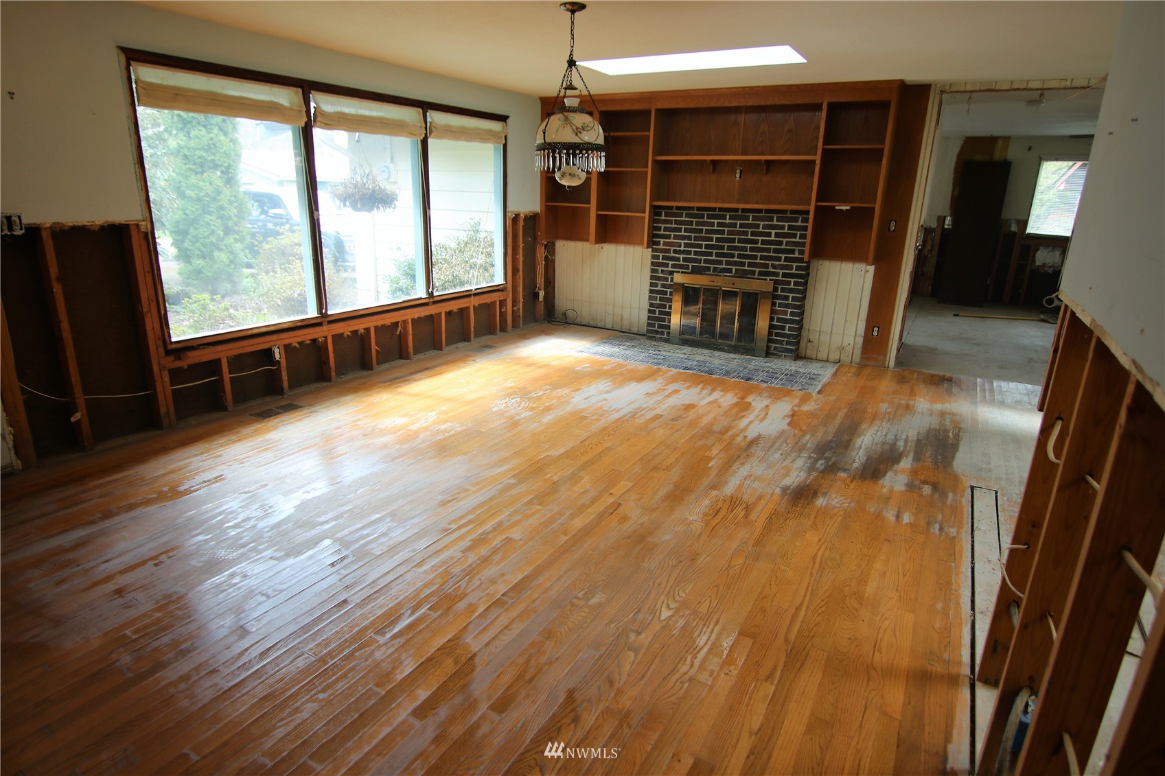 4354 Scutvik Road Deming, WA 98247 - Photo 3 of 39 an empty room with wooden floor and windows