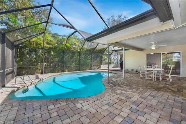 a view of a chairs and table in the patio