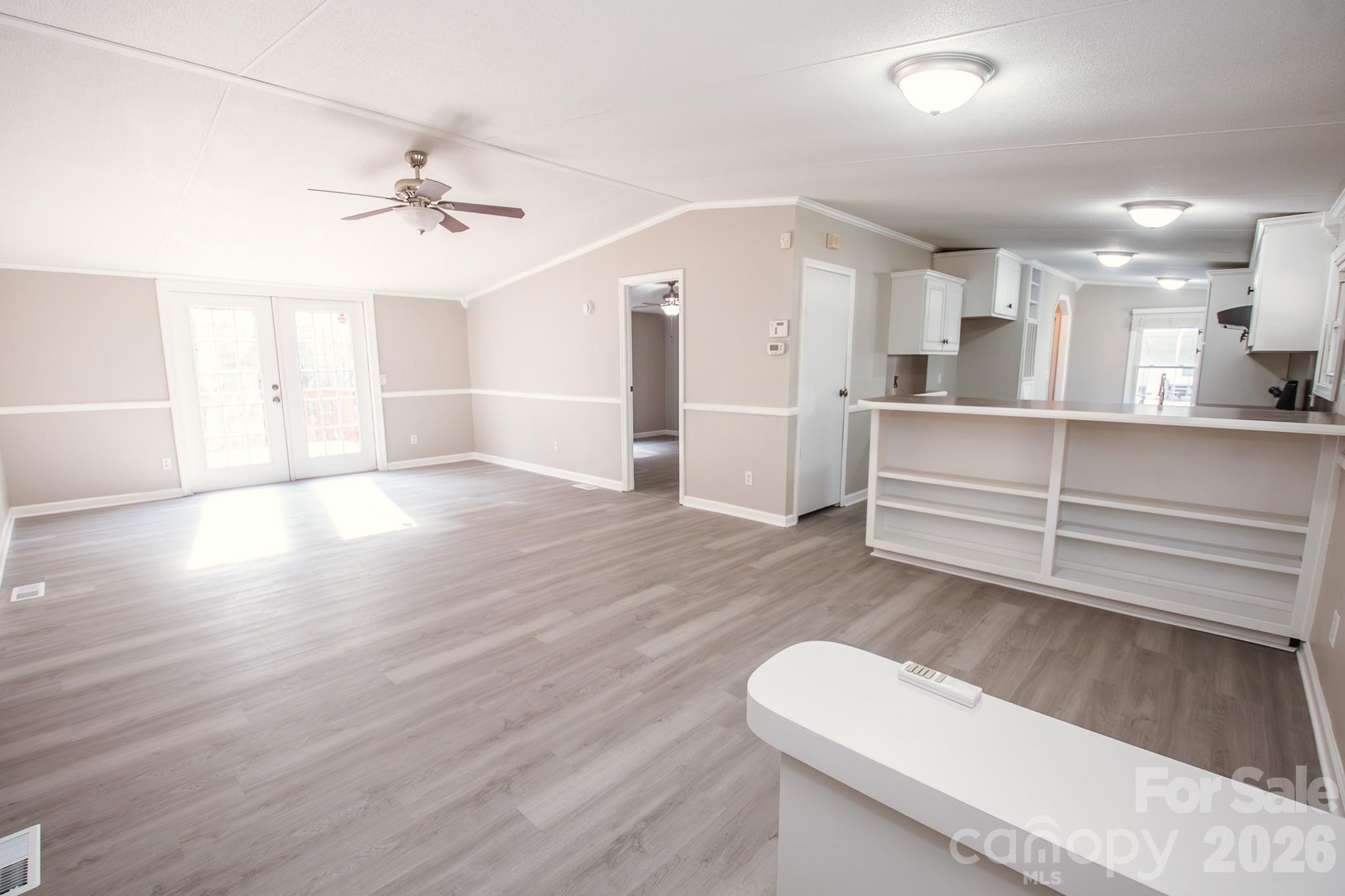 44082 Harper Hearne Road New London, NC 28127 - Photo 11 of 38 a view of a room with wooden floor and ceiling fan