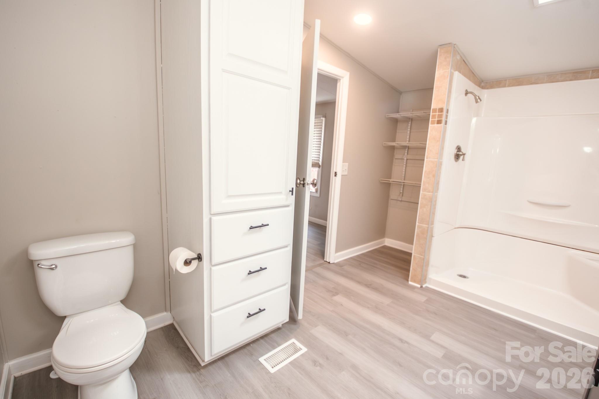 44082 Harper Hearne Road New London, NC 28127 - Photo 17 of 38 a bathroom with a toilet and a shower