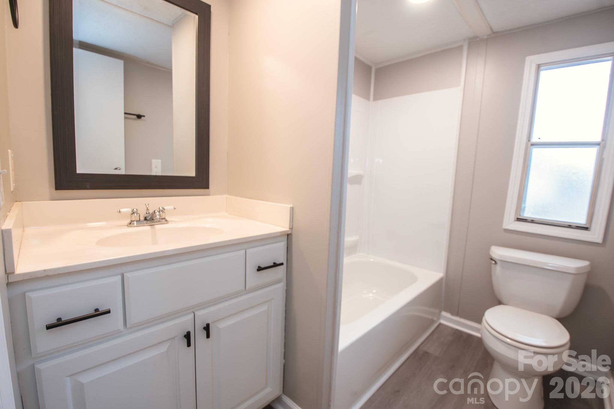 44082 Harper Hearne Road New London, NC 28127 - Photo 22 of 38 a bathroom with a sink toilet and shower