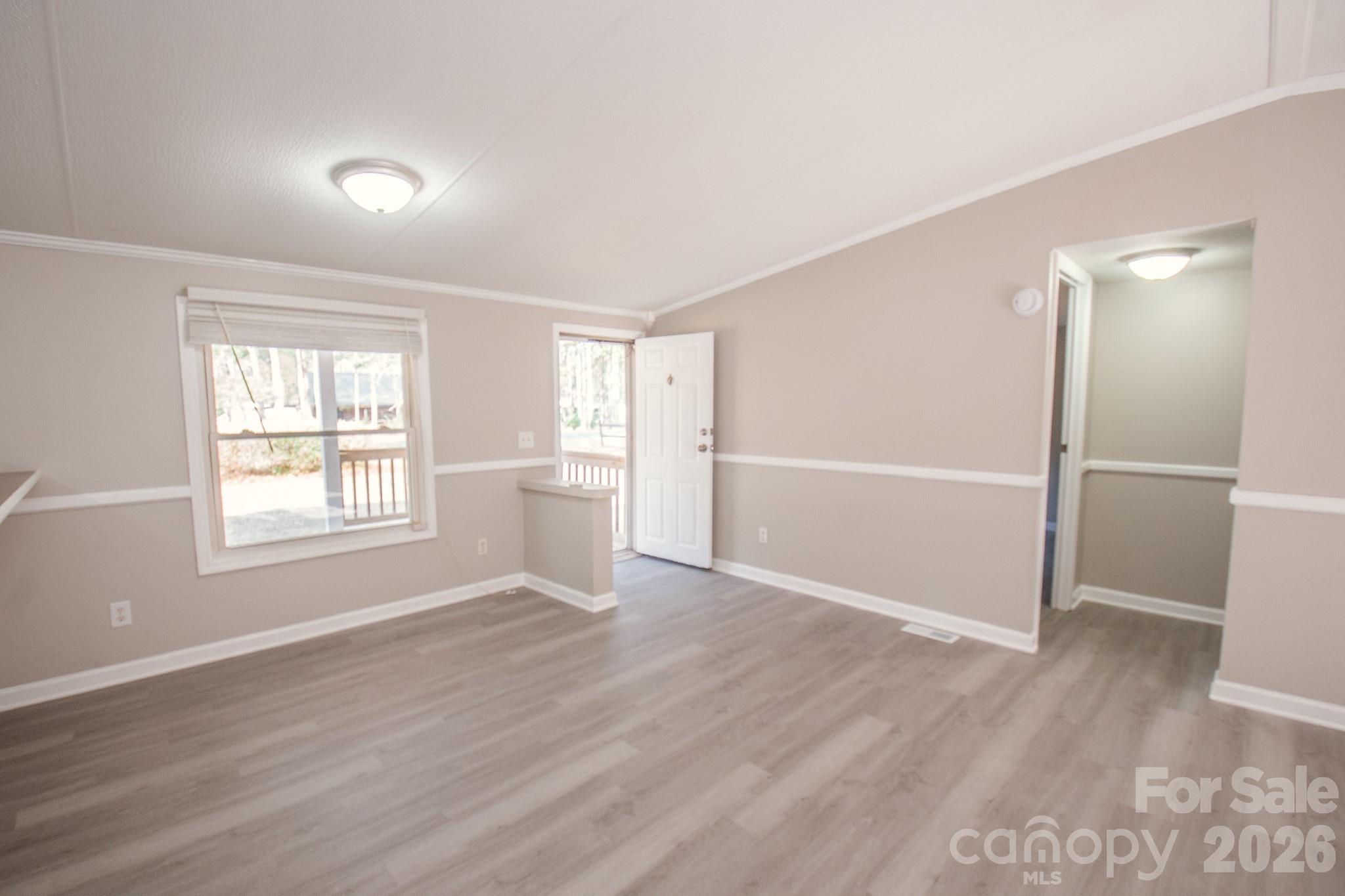 44082 Harper Hearne Road New London, NC 28127 - Photo 24 of 38 an empty room with wooden floor closet and windows