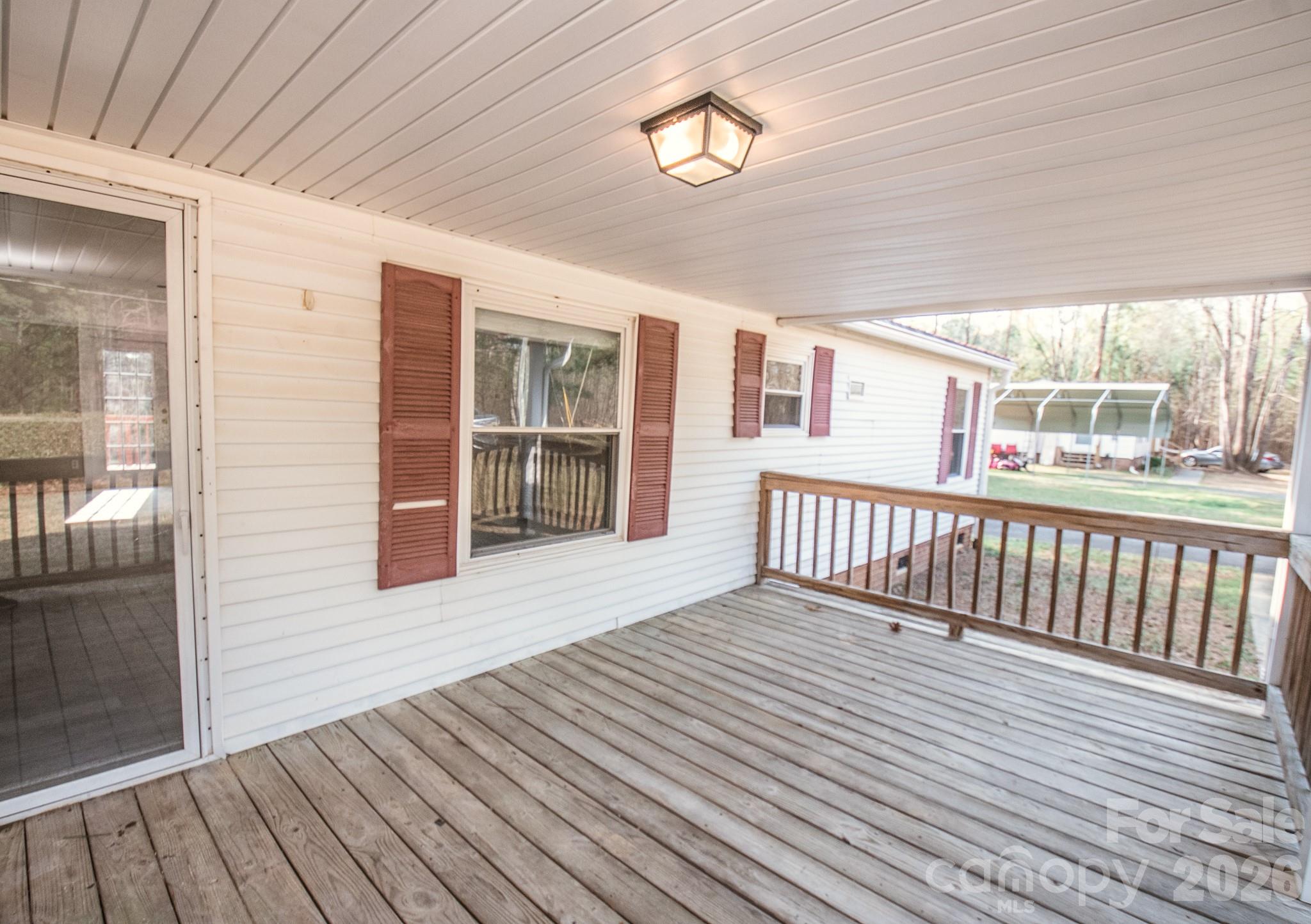44082 Harper Hearne Road New London, NC 28127 - Photo 26 of 38 a view of a balcony with wooden floor
