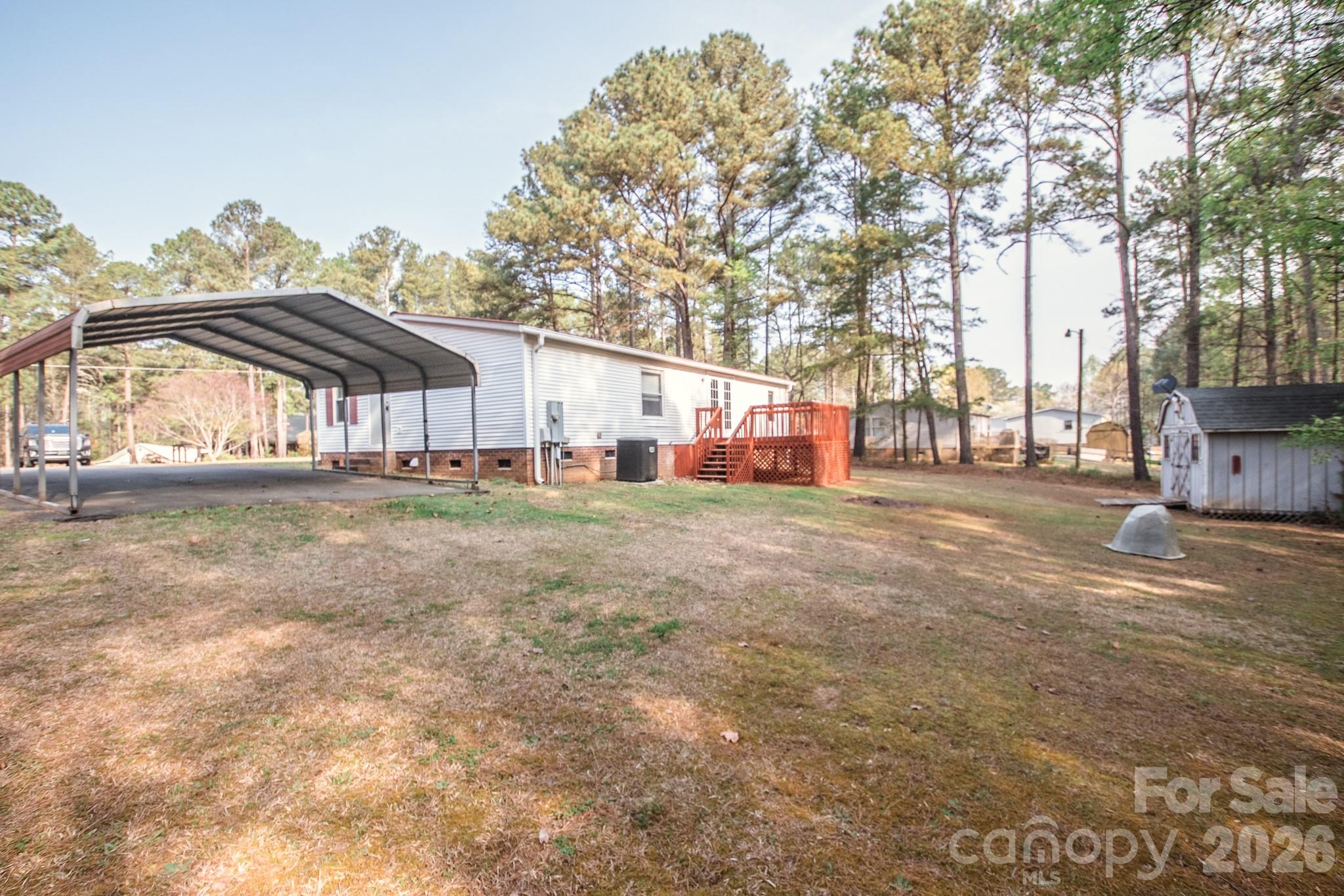 44082 Harper Hearne Road New London, NC 28127 - Photo 32 of 38 a view of large house with outdoor space