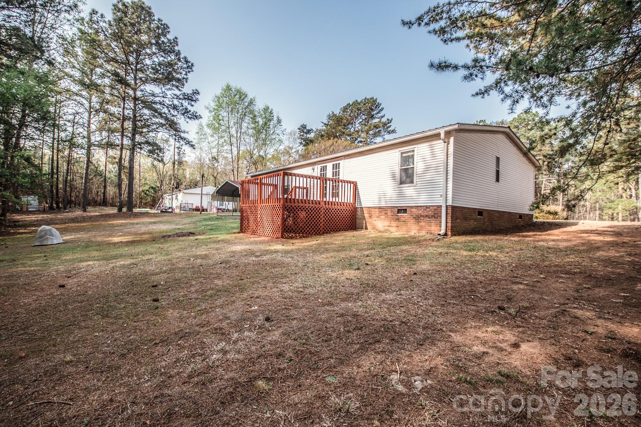 44082 Harper Hearne Road New London, NC 28127 - Photo 34 of 38 a view of a house with a yard