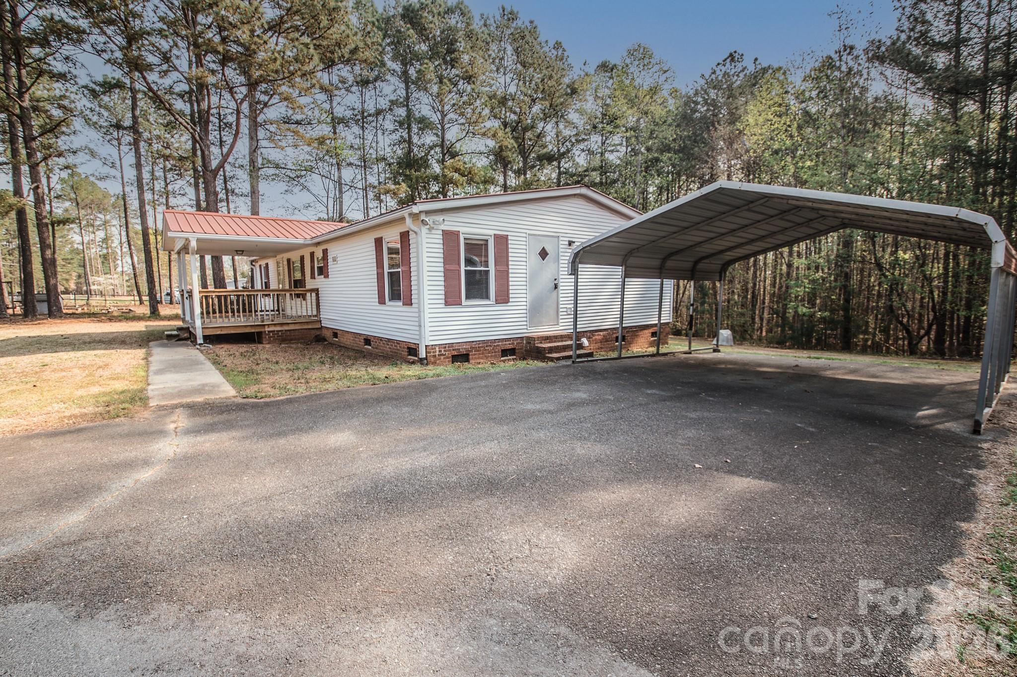 44082 Harper Hearne Road New London, NC 28127 - Photo 37 of 38 a view of a house with a yard