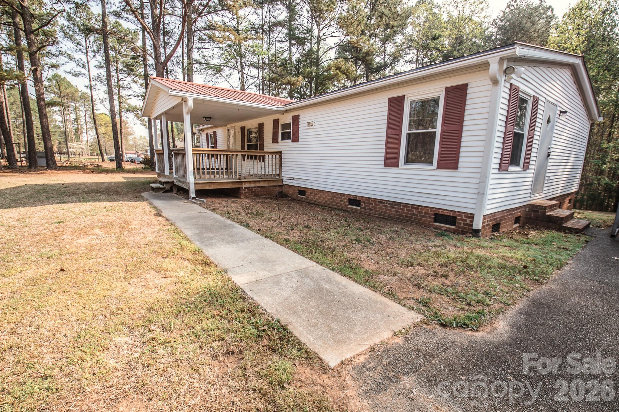 44082 Harper Hearne Road New London, NC 28127 - Photo 38 of 38 a view of a house with a yard