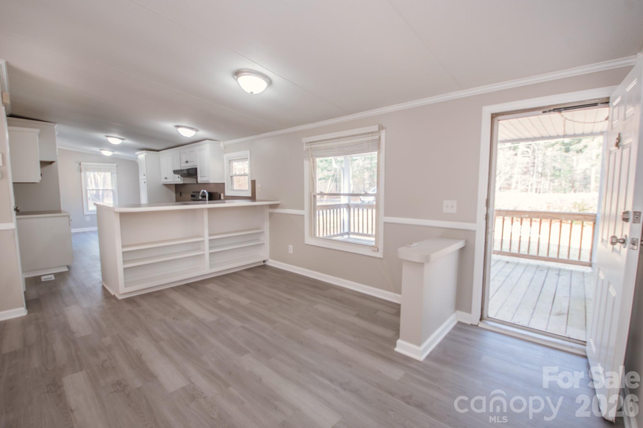 44082 Harper Hearne Road New London, NC 28127 - Photo 9 of 38 a room with wooden floors and white walls