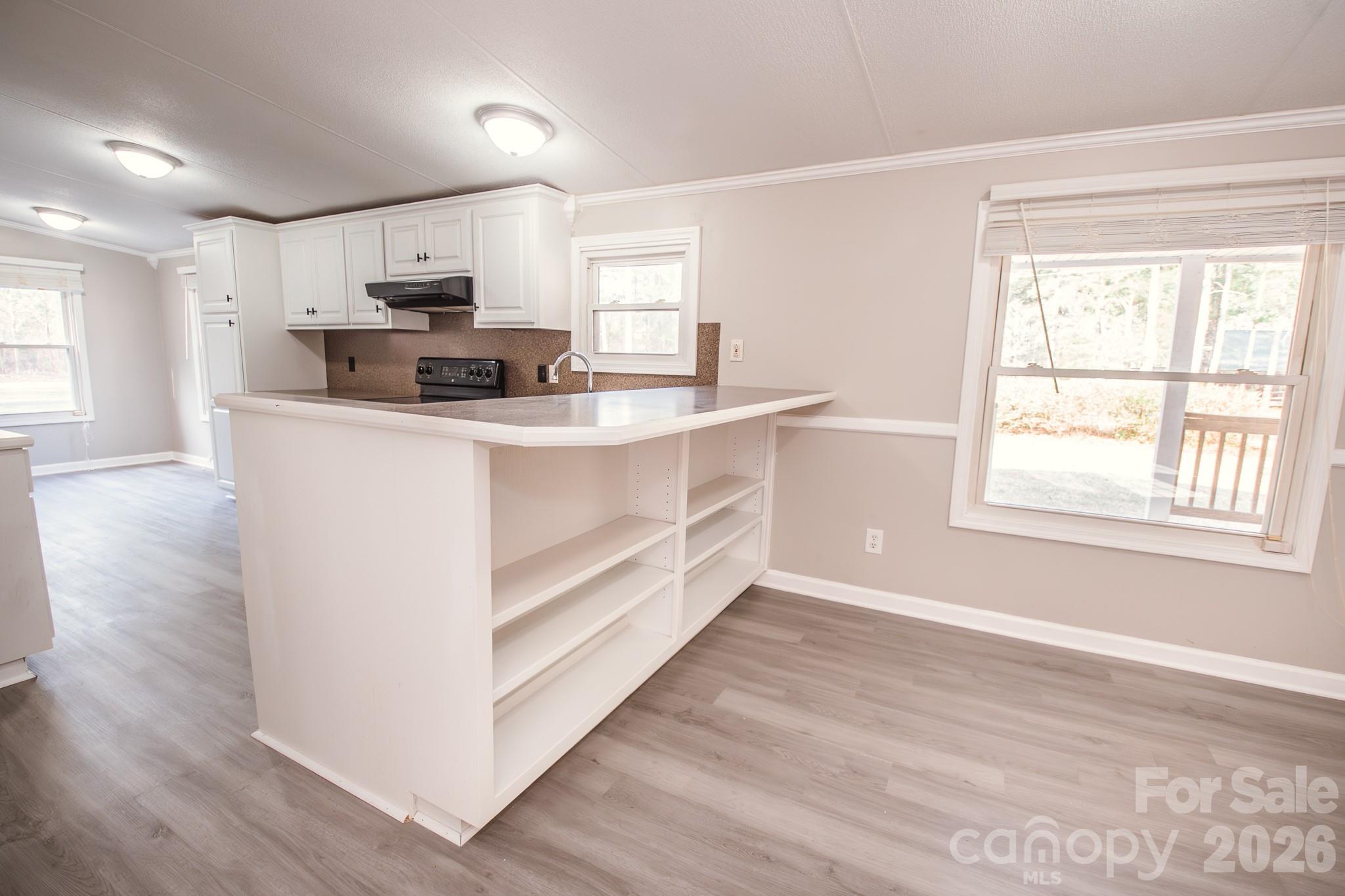 44082 Harper Hearne Road New London, NC 28127 - Photo 10 of 38 a view of kitchen with stainless steel appliances sink stove refrigerator and window