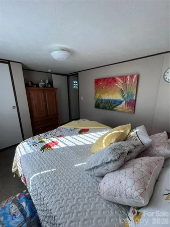 a bedroom with a bed and a view of bathroom