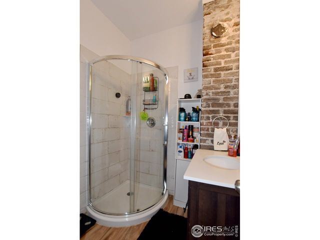 a bathroom with a sink and a shower