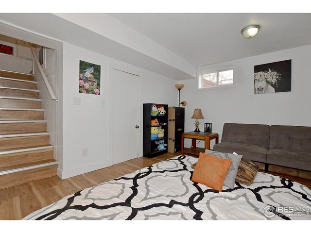 a workspace with furniture wall paintings and a window