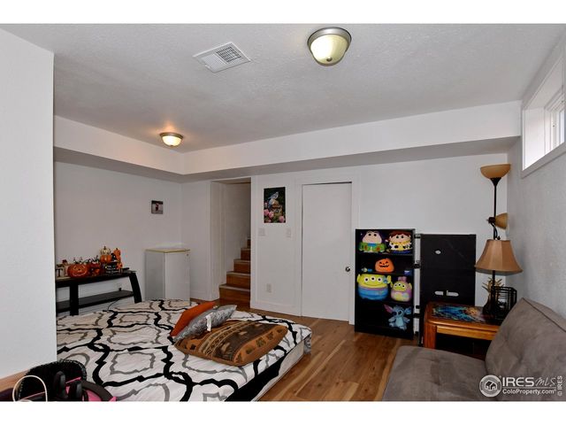 a bedroom with furniture and a window