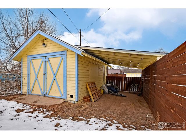 a view of house with wooden fence