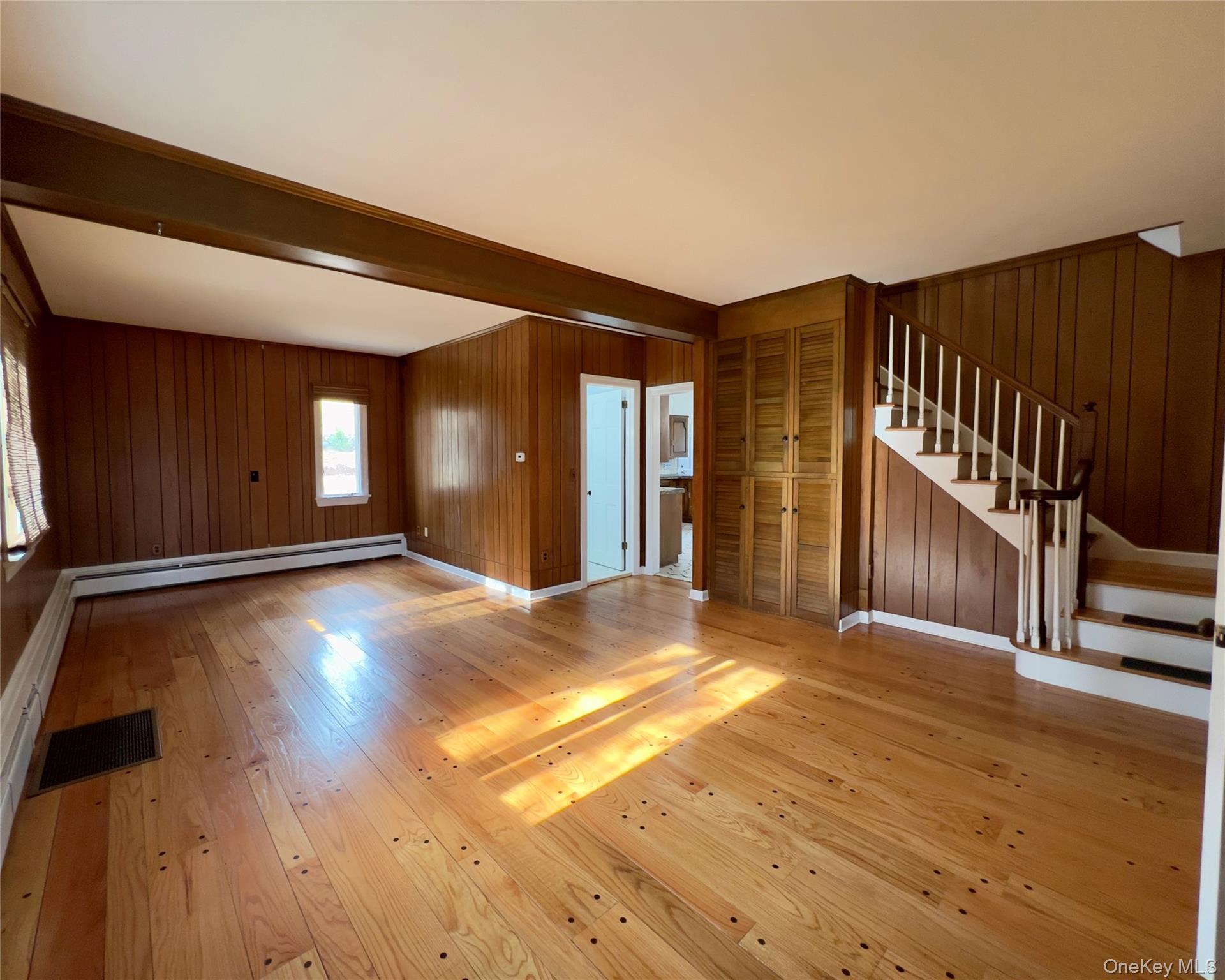 85 Washington Road Carmel, NY 10512 - Photo 11 of 30 a view of an empty room with wooden floor and a window