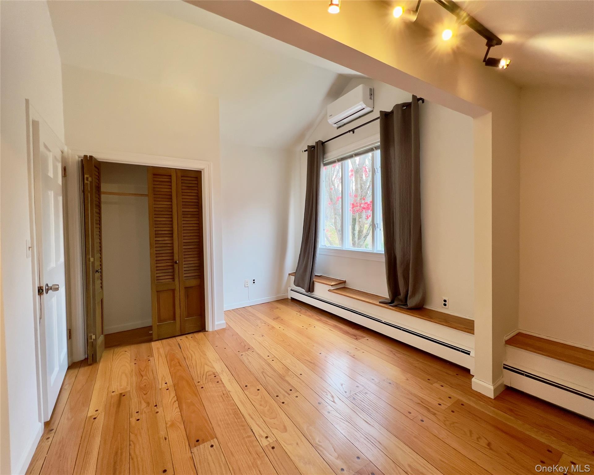 85 Washington Road Carmel, NY 10512 - Photo 19 of 30 a view of room with window and wooden floor