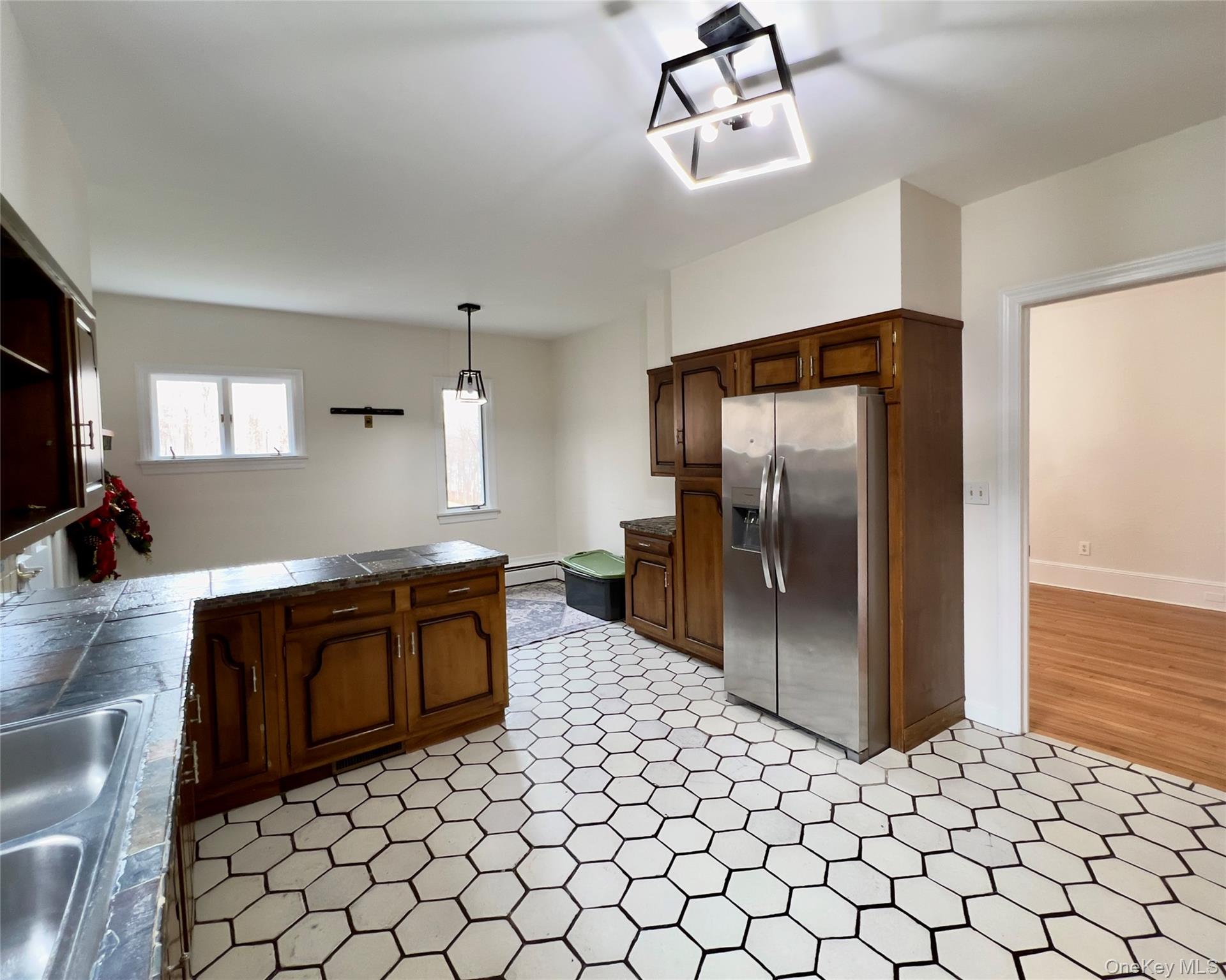 85 Washington Road Carmel, NY 10512 - Photo 2 of 30 a large kitchen with stainless steel appliances granite countertop a refrigerator and a sink