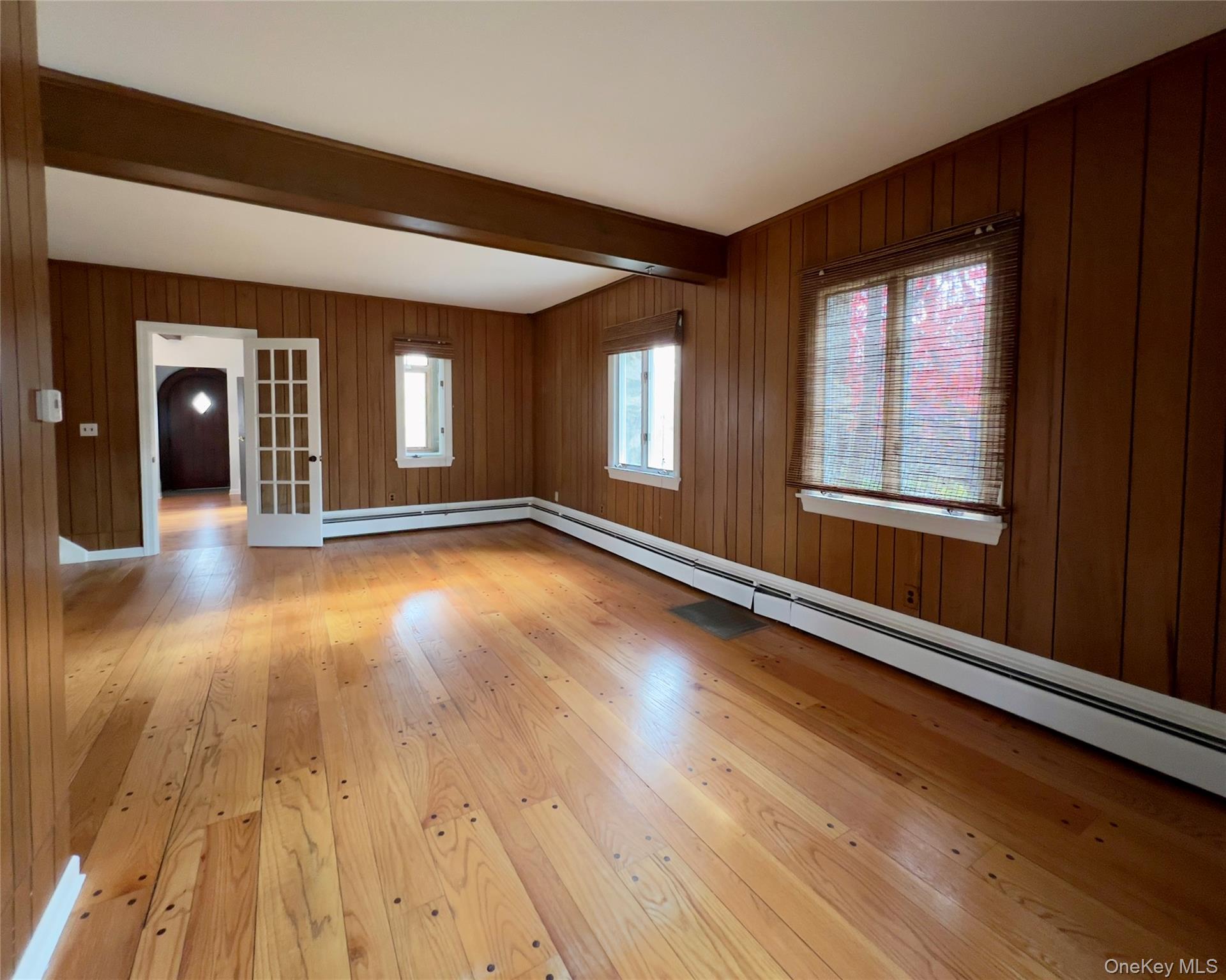85 Washington Road Carmel, NY 10512 - Photo 9 of 30 a view of an empty room with wooden floor and a window