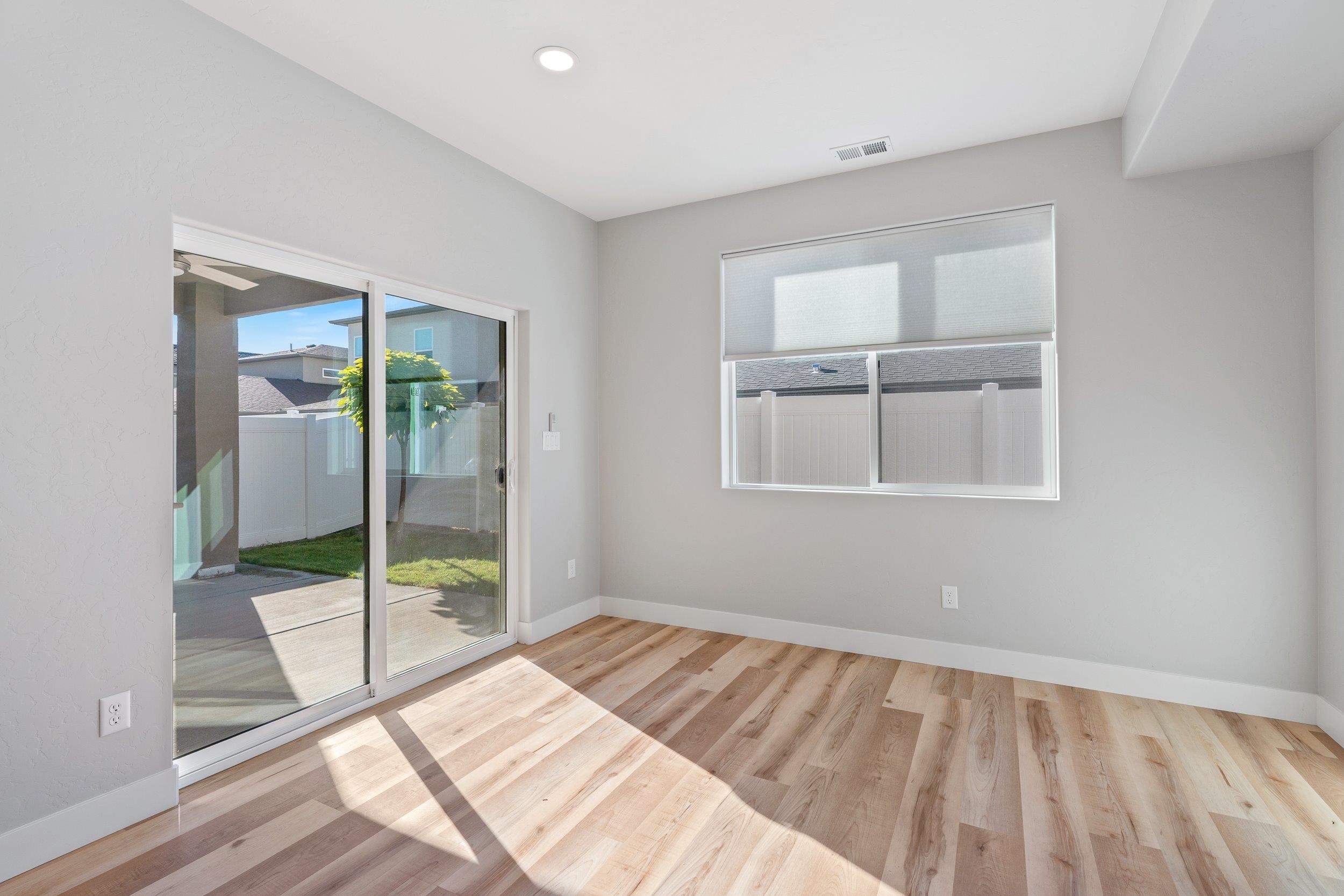2453 Ross Road, Unit A Grand Junction, CO 81505 - Photo 11 of 27 a room that has a bed and a window