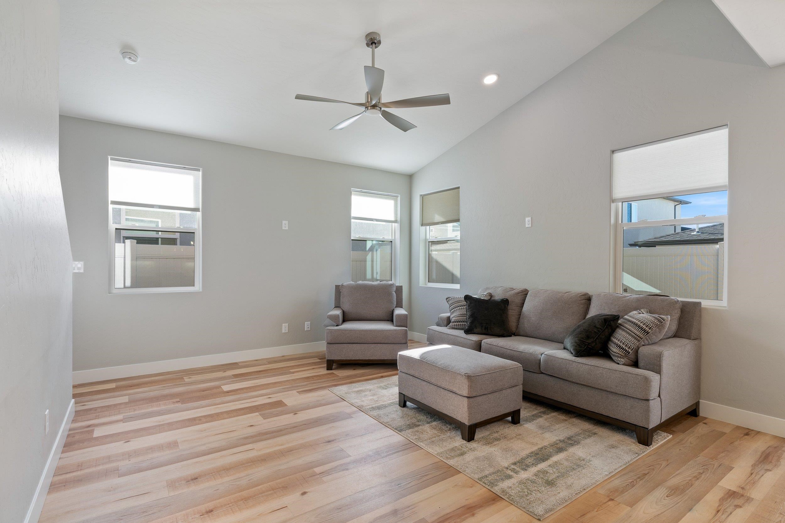 2453 Ross Road, Unit A Grand Junction, CO 81505 - Photo 4 of 27 a living room with furniture and a wooden floor