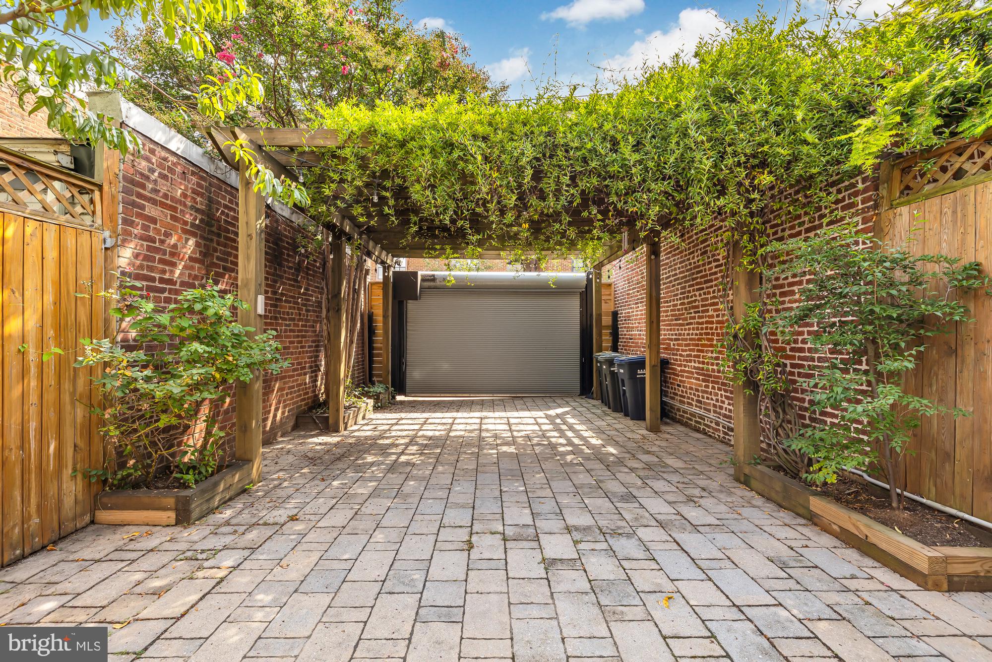 415 10th Street Northeast Washington, DC 20002 - Photo 46 of 51 Secure parking pad and patio with garage door