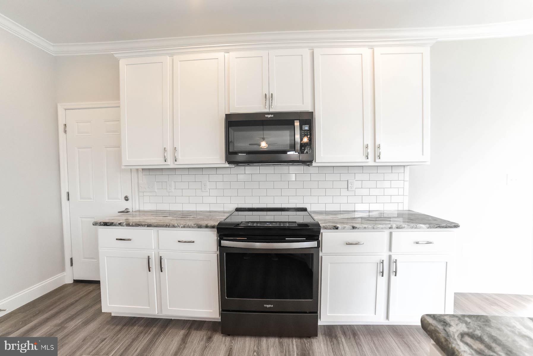 1155 Cove Point Road Lusby, MD 20657 - Photo 17 of 50 Black Stainless Stove and Microwave