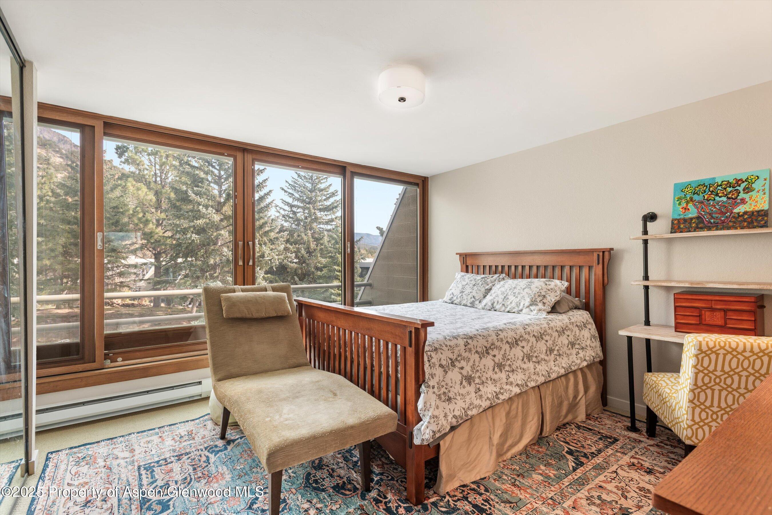 805 Pinon Drive, Unit 4 Basalt, CO 81621 - Photo 16 of 20 a bedroom with a bed window and a balcony