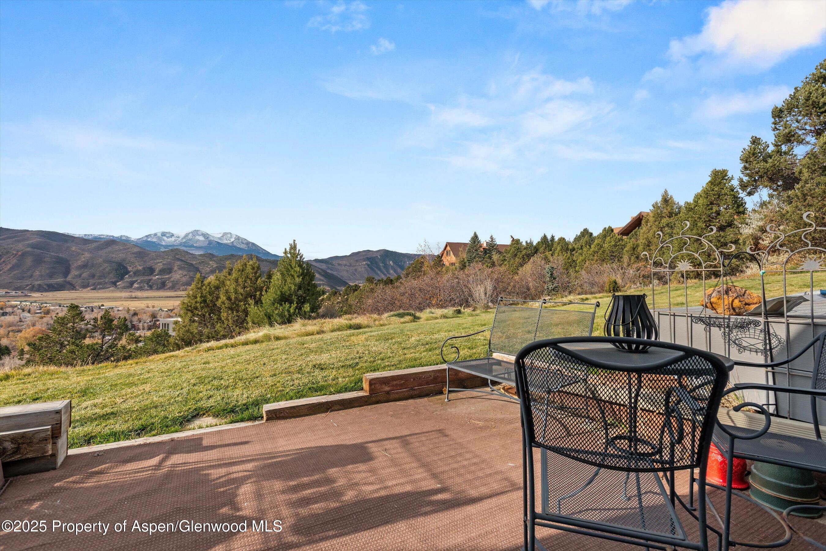 805 Pinon Drive, Unit 4 Basalt, CO 81621 - Photo 4 of 20 a view of a lake with a table and a potted plants