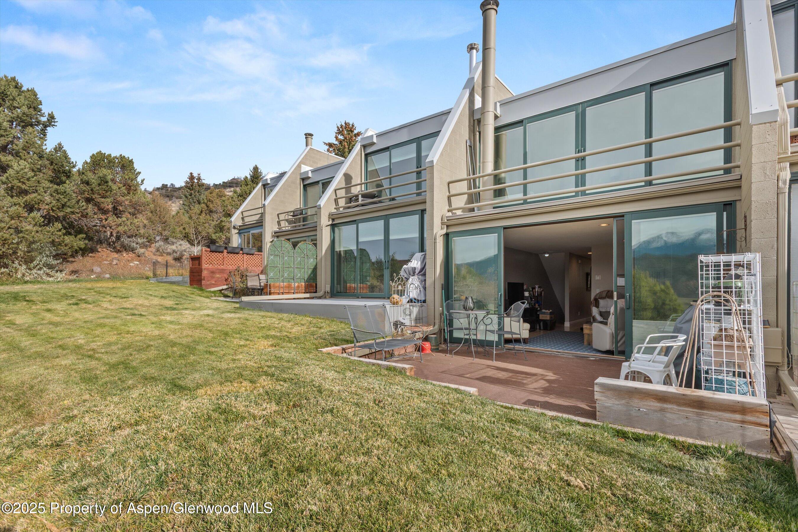 805 Pinon Drive, Unit 4 Basalt, CO 81621 - Photo 6 of 20 a view of a building with a outdoor space