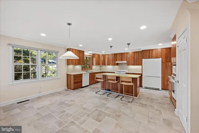 a room with a large window and chairs