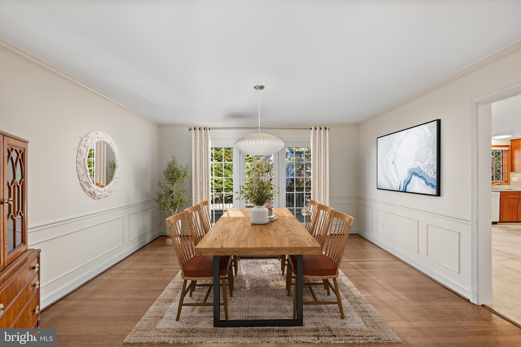 4238 50th Street Northwest Washington, DC 20016 - Photo 11 of 55 a dining room with furniture a rug and wooden floor