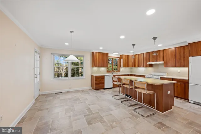 a kitchen with stainless steel appliances a sink and cabinets