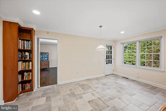 a view of room with window and cabinet