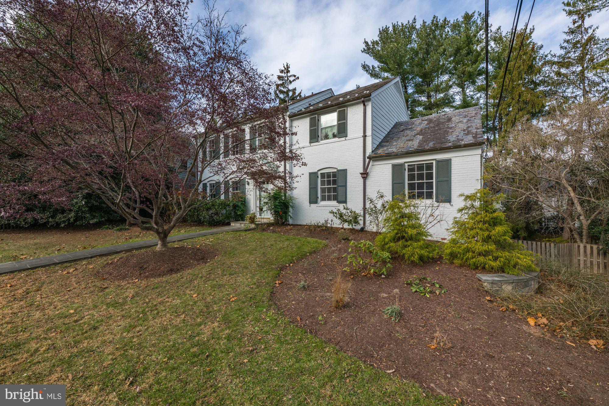 4238 50th Street Northwest Washington, DC 20016 - Photo 2 of 2 a front view of a house with garden