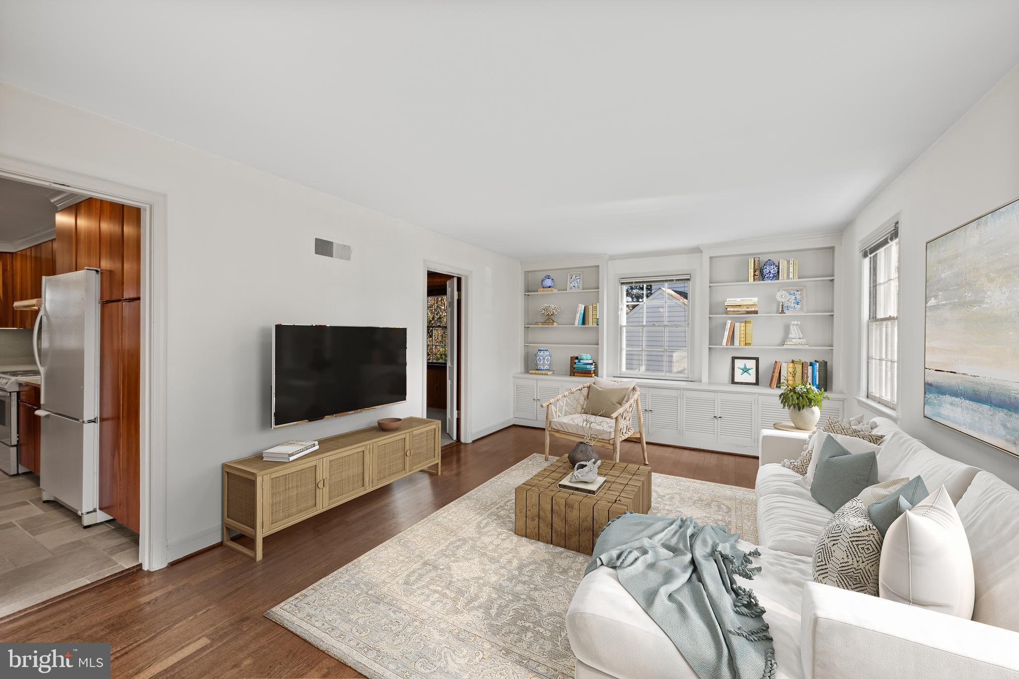4238 50th Street Northwest Washington, DC 20016 - Photo 23 of 55 a living room with furniture and a flat screen tv
