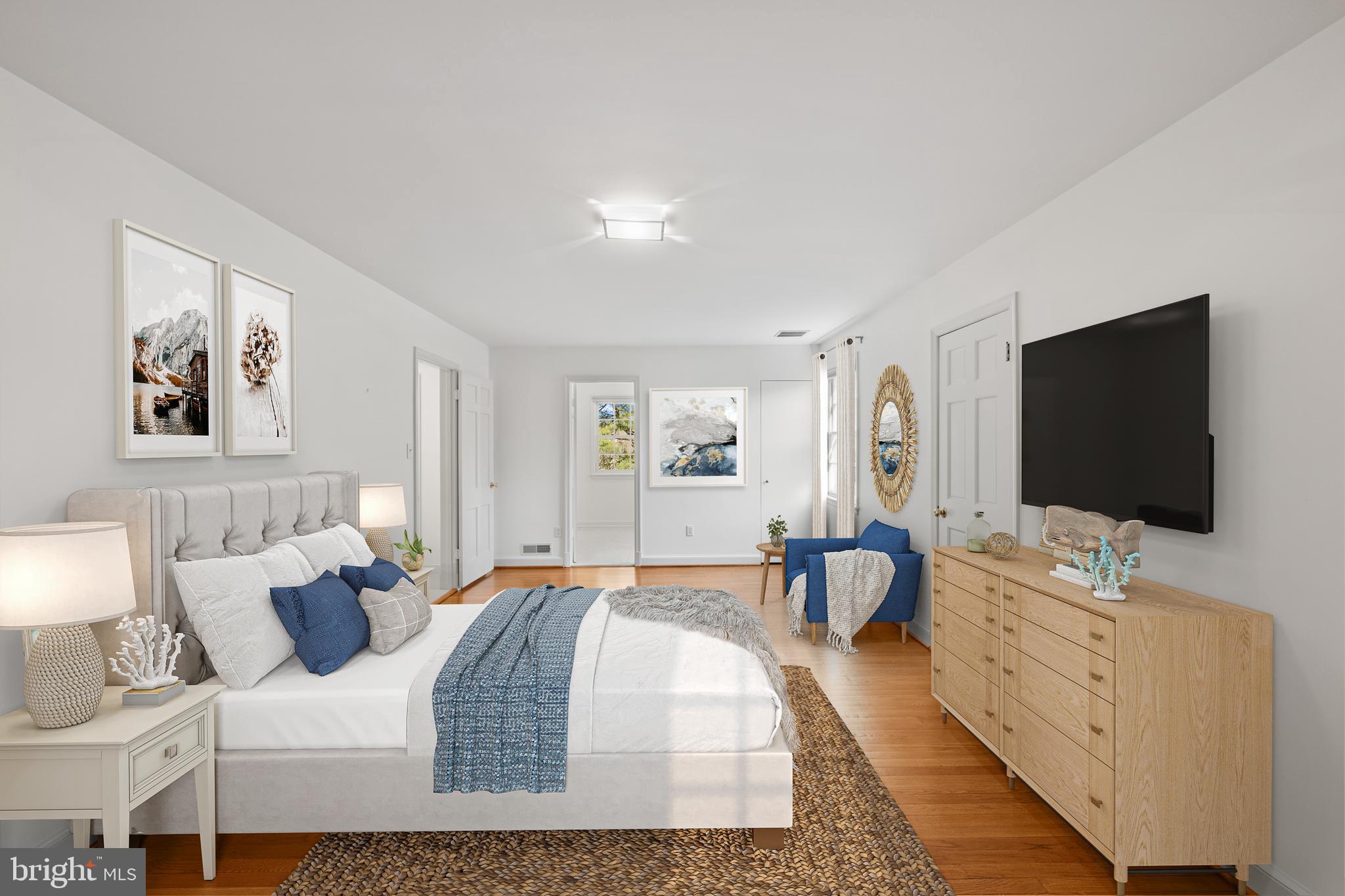 4238 50th Street Northwest Washington, DC 20016 - Photo 32 of 55 a bedroom with furniture and a flat screen tv