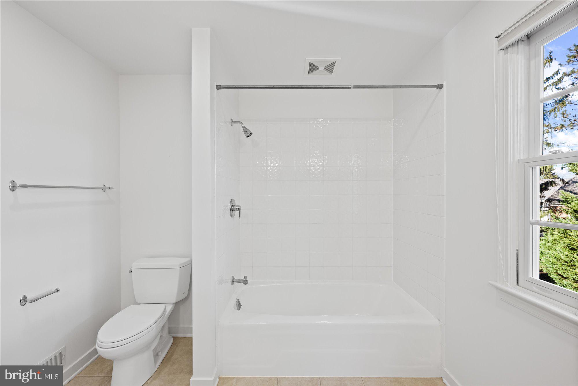 4238 50th Street Northwest Washington, DC 20016 - Photo 37 of 55 a bathroom with a shower and a toilet