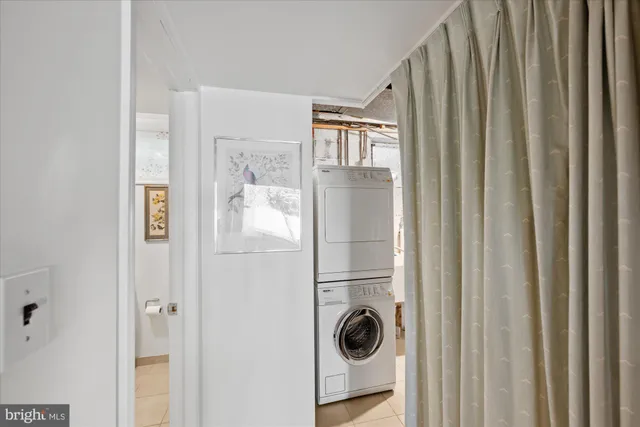a view of bathroom with a toilet sink and mirror