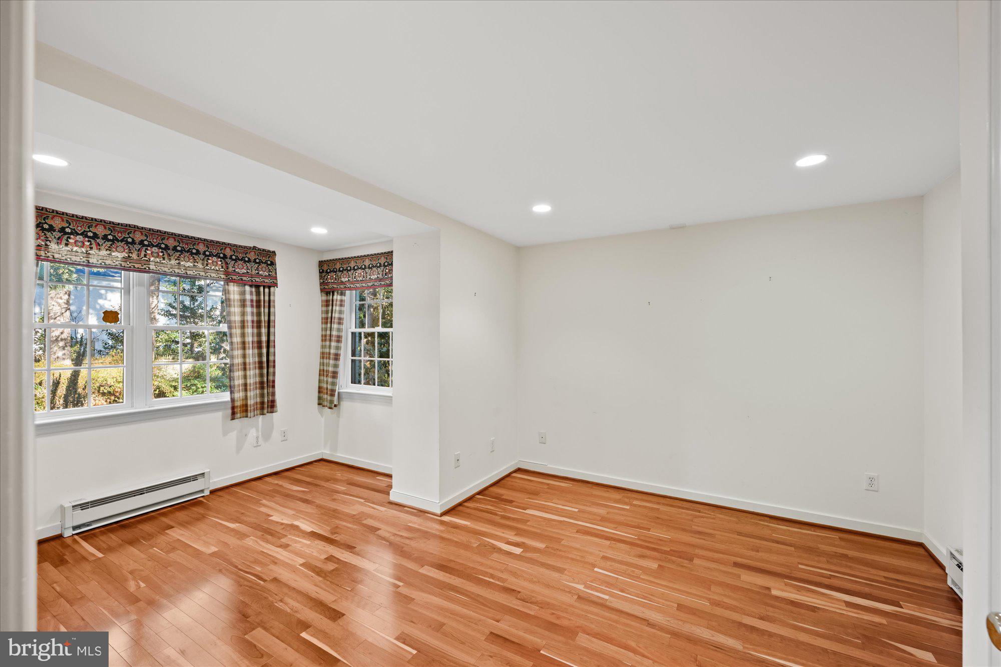4238 50th Street Northwest Washington, DC 20016 - Photo 46 of 55 a view of empty room with wooden floor and fan