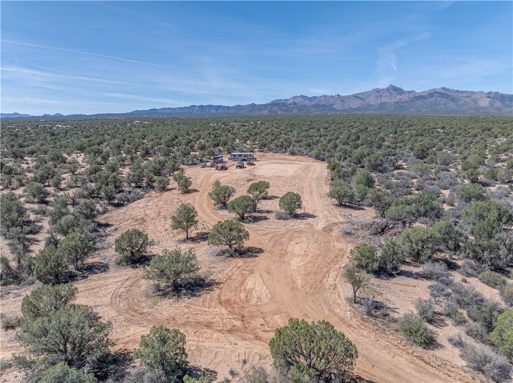 10116 East Hidden Valley Road Kingman, AZ 86401 - Photo 26 of 58 a view of a lake with mountains and a houses