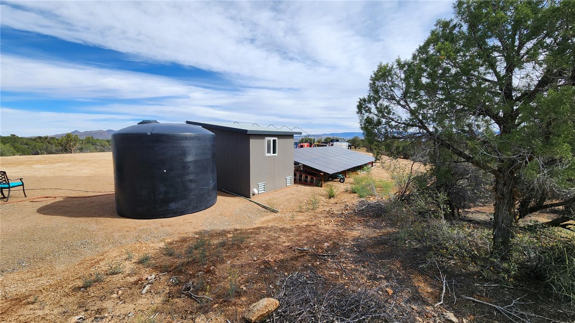 10116 East Hidden Valley Road Kingman, AZ 86401 - Photo 35 of 58 a view of a dry yard with wooden fence