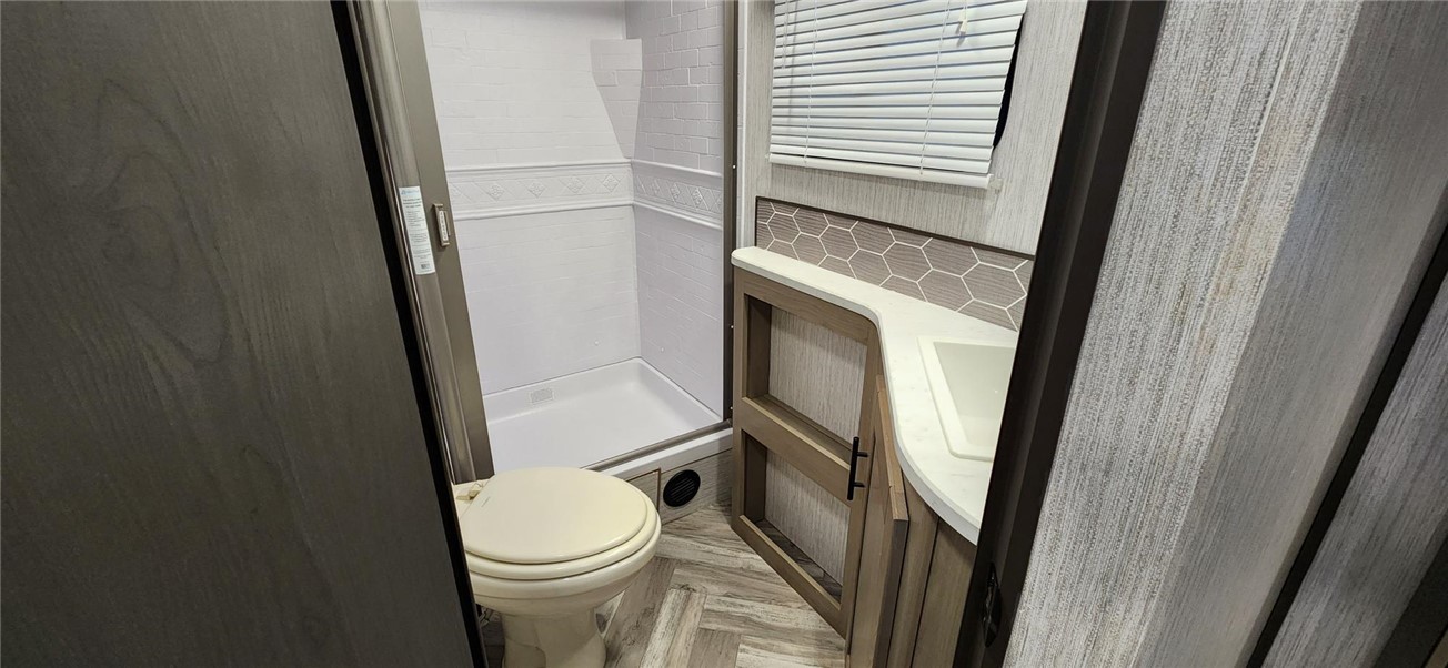 10116 East Hidden Valley Road Kingman, AZ 86401 - Photo 56 of 58 a white toilet sitting next to a sink