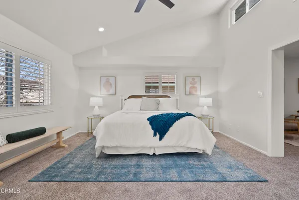 a bedroom with a bed and a couch