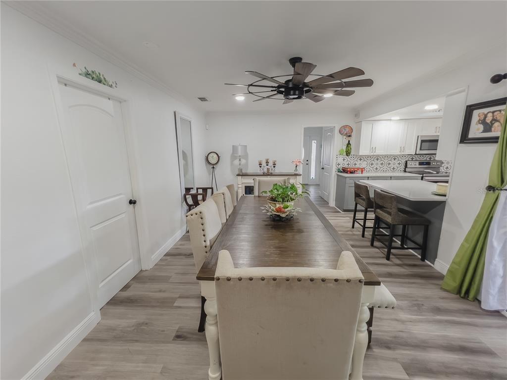 1810 Anchor Avenue DeLand, FL 32720 - Photo 11 of 29 a view of a dining area with furniture window and wooden floor