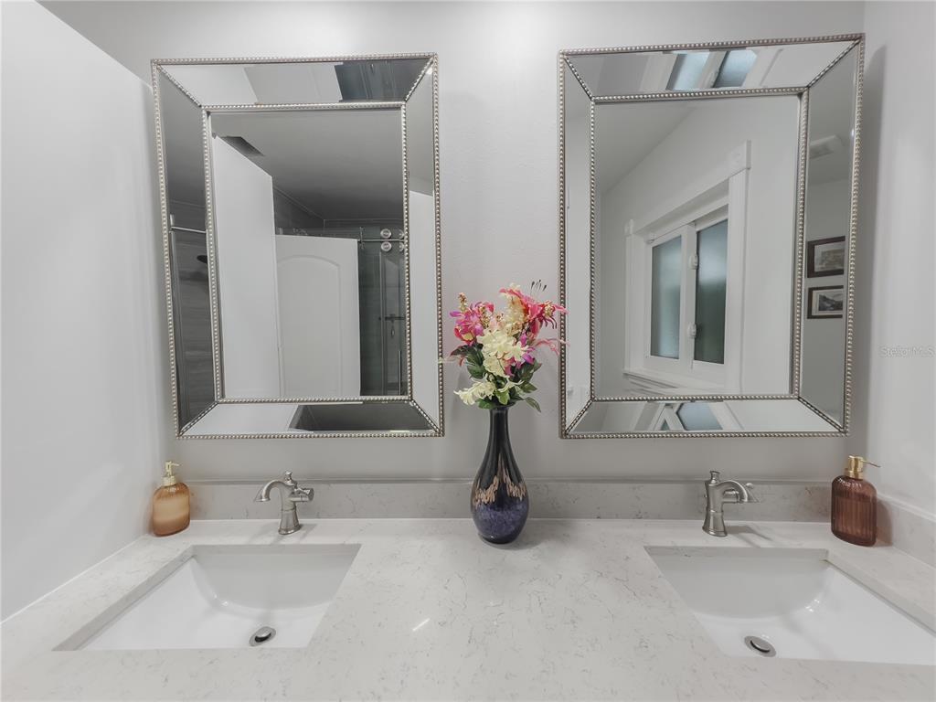 1810 Anchor Avenue DeLand, FL 32720 - Photo 16 of 29 a bathroom with a sink and a mirror