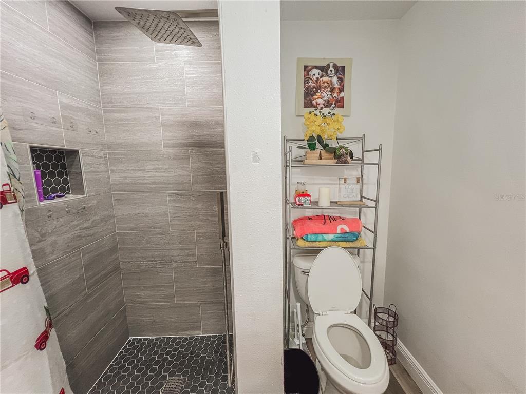 1810 Anchor Avenue DeLand, FL 32720 - Photo 21 of 29 a bathroom with a toilet and a shower